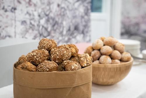 a pile of nuts in a container on a table at Art Hotel Tartini in Piran