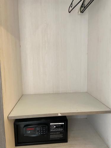 a shelf in the corner of a room at Dash Hotels - Affordable Luxury in Hyderabad
