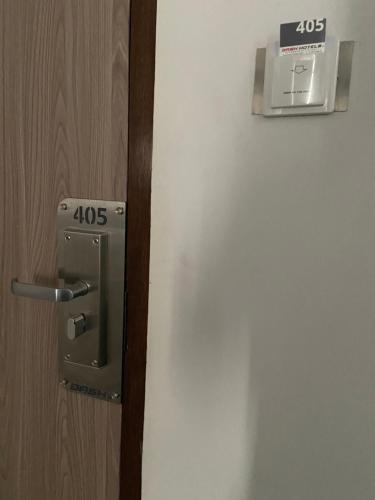a close up of a door with a sign on it at Dash Hotels - Affordable Luxury in Hyderabad
