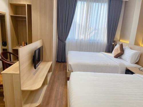 Giường trong phòng chung tại Thanh Bình Hotel - 47 Y Bih - BMT