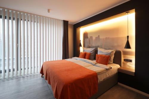 Ένα ή περισσότερα κρεβάτια σε δωμάτιο στο JustStay Solingen