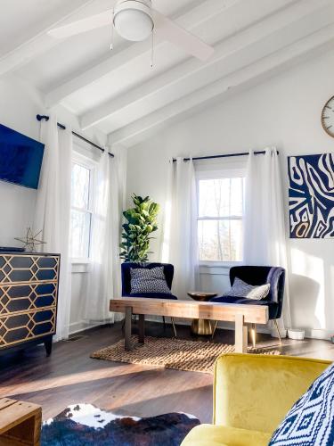 a living room with a couch and a table at Mountain Retreat Nesteled in the Virginia Foothills in Charlottesville