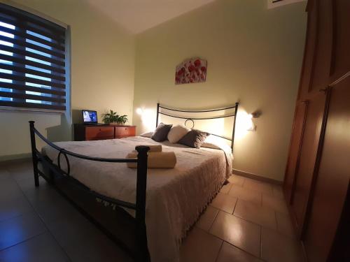 Tempat tidur dalam kamar di Casa Giampiero