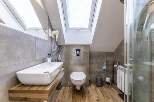 Koupelna v ubytování Apartamenty 73