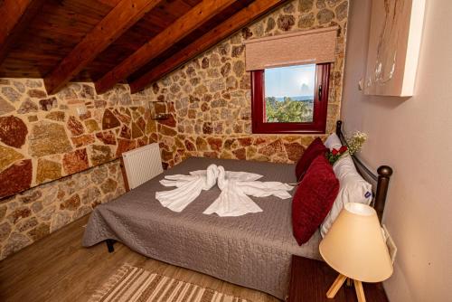 A bed or beds in a room at Sea Rock Villa Rodos