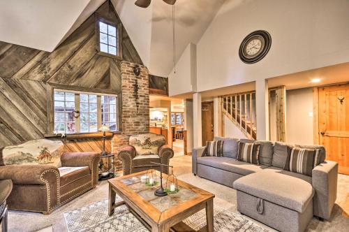 a living room with couches and a table at Walk to Zigzag River The Sundance Cottage in Rhododendron