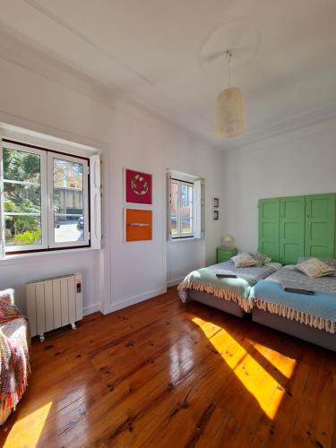 Ένα ή περισσότερα κρεβάτια σε δωμάτιο στο Maria Saudade Apartamento