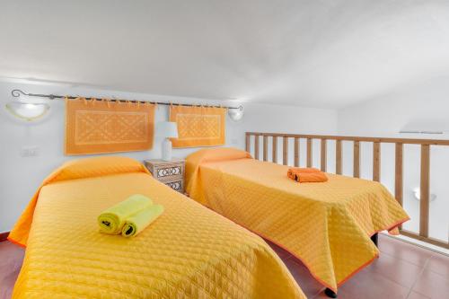Postel nebo postele na pokoji v ubytování Gli Ulivi Palau - Lu Maccioni