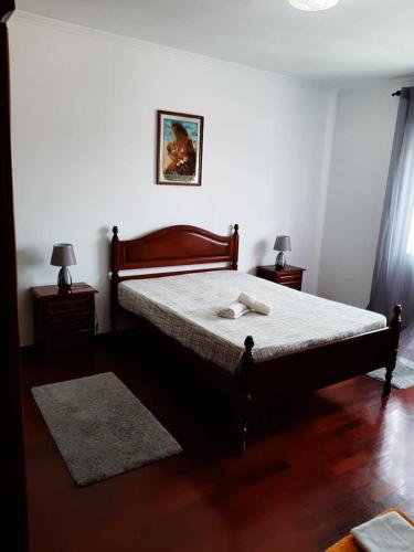 Postel nebo postele na pokoji v ubytování Quarto1 com wc privado e cozinha partilhada