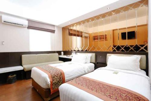 Krevet ili kreveti u jedinici u objektu Favor Hotel Makassar City Center By LIFE