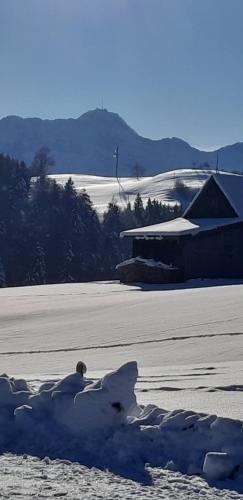 a pile of snow on the ground in front of a building at Loft in der Natur mit Gartenzugang und Sauna in Herisau