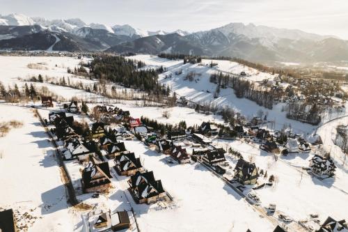 an aerial view of a ski resort in the snow at Osada Bachledzki Wierch Odkryj Zakopane in Zakopane