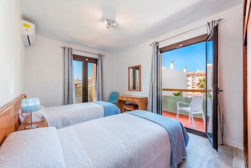 Posteľ alebo postele v izbe v ubytovaní Apartamento Bressol 3ºb