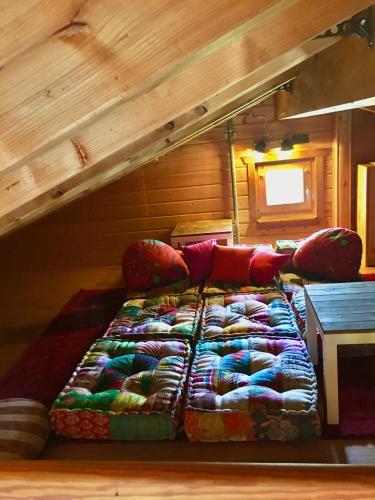 a bed sitting in the middle of a room at Ferienhaus Bergglück in Nonnweiler