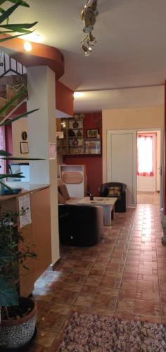 a living room with a couch and a table at Casa Terzea in Râşnov