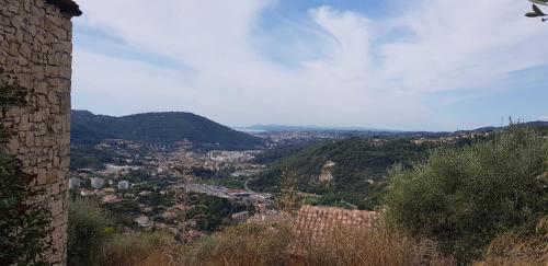 a view of a city from a hill at Le Chalet de la Pierreraie Côte d'Azur Piscine Terrasse et Vue Mer in Drap