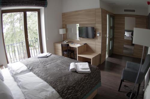 מיטה או מיטות בחדר ב-Hotel Therapia