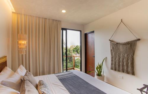 Cama o camas de una habitación en Macondo Tulum