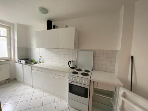 Kuchyň nebo kuchyňský kout v ubytování Apartmenthaus Home24