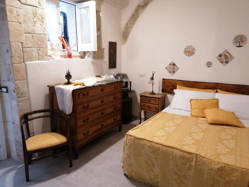 Postel nebo postele na pokoji v ubytování Il Cortiletto di Via Minniti