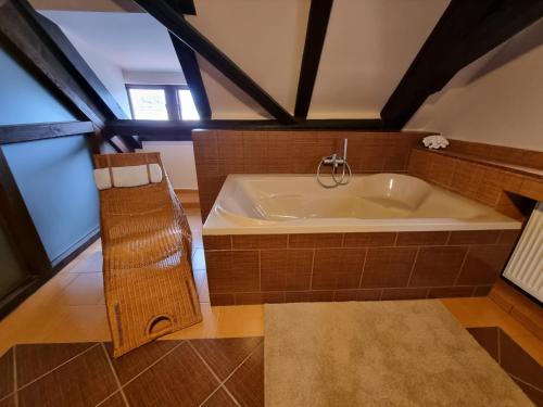 a large bathroom with a large tub in a room at Galerie Vila Lucia 5 -Loft apartmán in Plzeň