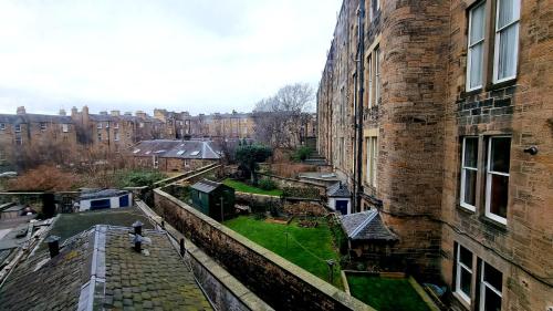a view of a city from the window of a building at The Guards Hotel in Edinburgh