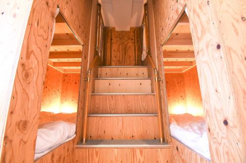 a wooden room with two bunk beds in it at Manabiamu 4F - Vacation STAY 43656v in Maizuru