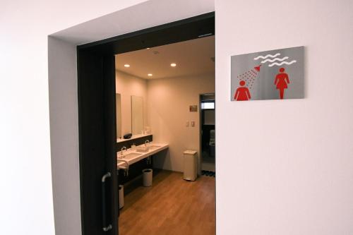 a bathroom with two sinks and a mirror at Manabiamu 4F - Vacation STAY 43664v in Maizuru