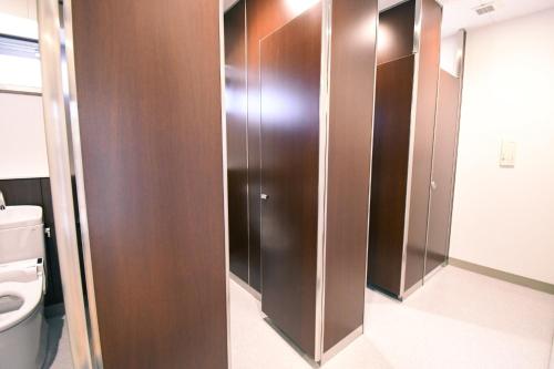 a bathroom with wooden stalls with a toilet at Manabiamu 4F - Vacation STAY 58915v in Maizuru