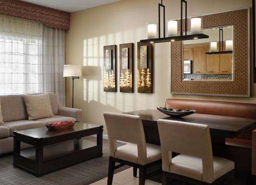 a living room with a table and chairs and a couch at Hyatt Vacation Club at the Welk, San Diego in Escondido