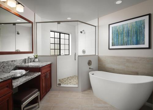 a bathroom with a large tub and a shower at Hyatt Vacation Club at the Welk, San Diego in Escondido