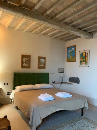 מיטה או מיטות בחדר ב-Agriturismo Borgo Pirolino