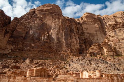 ancient ruins in front of a rocky mountain at Wadi Rum Nights in Wadi Rum