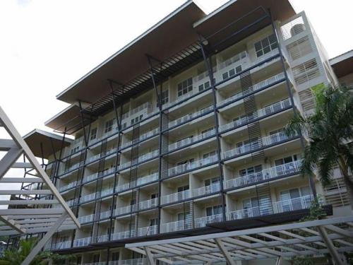 a large building with balconies on the side of it at Beach condos at Pico de Loro Cove - Wi-Fi & Netflix, 42-50''TVs with Cignal cable, Uratex beds & pillows, equipped kitchen, balcony, parking - guest registration fee is not included in Nasugbu