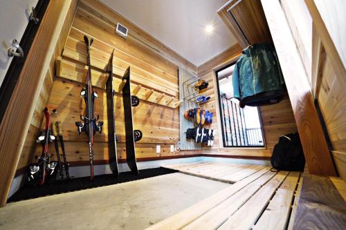 a room with a bunch of skis in a wall at Tombi Lodge - Vacation STAY 14464v in Iiyama