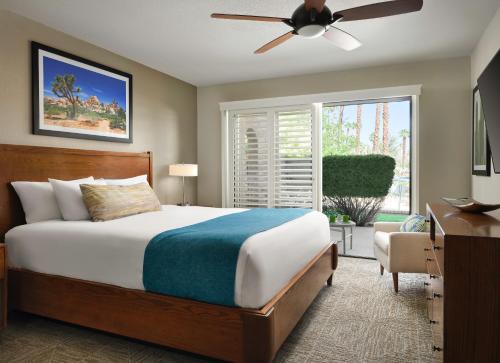 a bedroom with a bed and a ceiling fan at Hyatt Vacation Club at Desert Oasis in Cathedral City