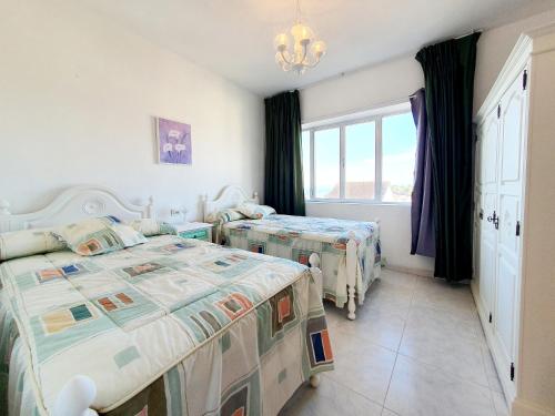 Postel nebo postele na pokoji v ubytování Apartamentos Romaris