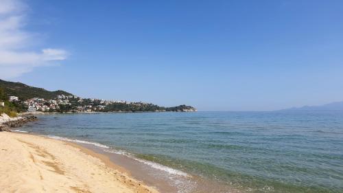 a view of a beach with the ocean at Alma Maisonette in Kavala