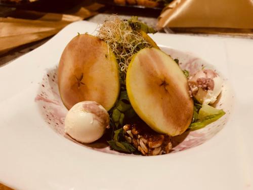 a bowl of food with apples and other vegetables at Real Hispano in Valladolid
