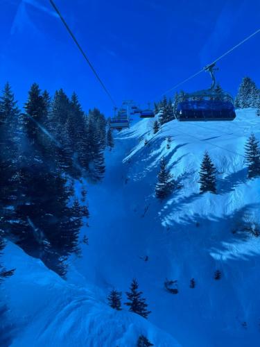 a ski lift is going down a snow covered slope at Villa 80 Kodra e Diellit in Tetovo