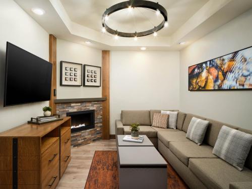a living room with a couch and a fireplace at Hyatt Vacation Club at The Ranahan in Breckenridge