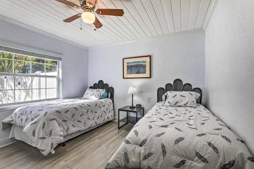 a bedroom with two beds and a ceiling fan at Chic Home with Fire Pit and Patio, Walk to Lake! in Dublin