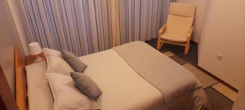 Ein Bett oder Betten in einem Zimmer der Unterkunft Aveiro Theater Rooms