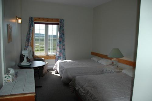 Кровать или кровати в номере Wildberry Country Lodge B&B