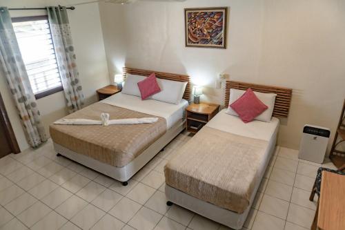 Voodi või voodid majutusasutuse Quo Vadis Dive Resort toas