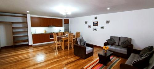 Кът за сядане в 7th Wonder Apart Hotel Cusco