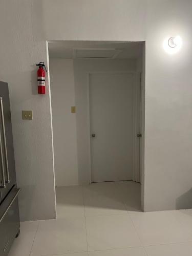 an empty room with a fire hydrant on the wall at Joy Estate Rooftop Pool n View unit #1 in Falmouth