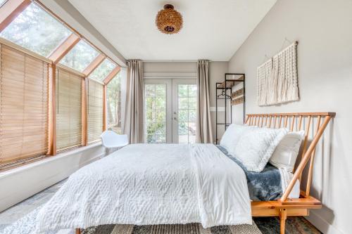 a bedroom with a bed and a window at Hood Hideaway in Welches