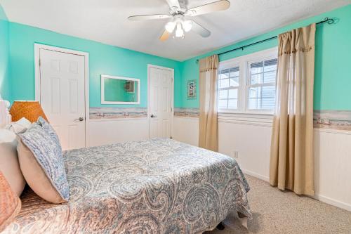 a bedroom with a bed and a ceiling fan at Cherry Grove 26 in Myrtle Beach