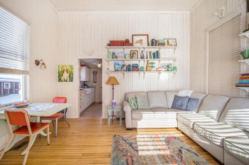 a living room with a couch and a table at Lake Daze in Boyne City